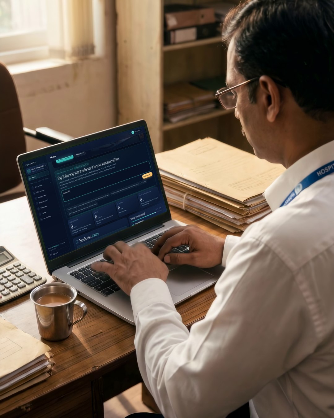 A hospital professional reviewing Canipus on a laptop